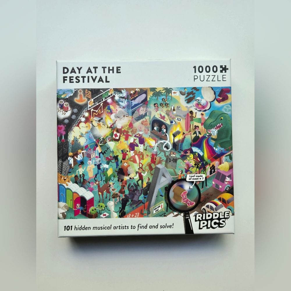 Day At The Festival 1000 piece jigsaw puzzle with 101 riddles to solve